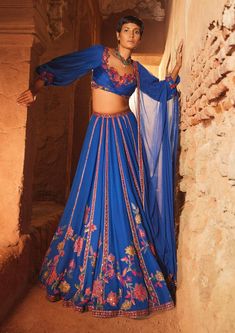 Editor's Note Featuring A Royal Blue Embroidered Georgette Draped Blouse And Georgette Embroidered Lehenga Paired With Net Embroidered Dupatta Fabric: Blouse: Georgette, Lehenga :Georgette, Dupatta: Net Color: Blue Components: Lehenga, Blouse And Dupatta Sleeve Length: Full Sleeve Neckline: Sweetheart Neckline Care: Dry Clean Only About the Designer Ridhi Mehra follows a minimalist yet effective design philosophy, working with solid colors and floral embroidery. She has brought together western Royal Blue Lehenga, Drape Blouse, Ridhi Mehra, Georgette Lehenga, Diamond Tile, Georgette Dupatta, Lehenga Wedding, Blue Lehenga, Embroidered Crop Tops