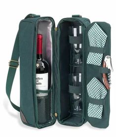 an open wine bottle and two glasses in a green case with silverware on the side