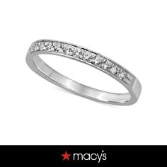 a white gold wedding band with channeled diamonds on the side and an inscription macy's