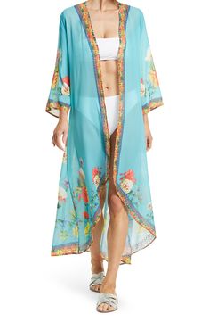 Unleash your free boho spirit in this longline duster styled with vivid allover blooms and airy flare sleeves. V-neck Flare sleeves Hi-low skirt All-over bloom print Solid Woven 100% polyester Hand wash cold, line dry Imported Model stats: 5'10", 32" bust, 25" waist, 36" hip. Model is wearing size S. Floral Print Flowy Maxi Cover-up, V-neck Floral Print Festival Cover-up, Bohemian V-neck Cover-up With Floral Print, Bohemian V-neck Floral Print Cover-up, Spring Flowy Maxi Cover-up, Flowy Spring Maxi Cover-up, Flowy Floral Print Maxi Length Cover-up, Spring Bohemian Open Front Cover-up, Bohemian Open Front Cover-up For Spring