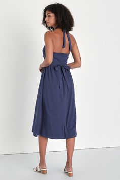 Stroll beneath the palm trees looking oh-so-cute in the Lulus Sayulita Scene Navy Blue Embroidered Belted Halter Midi Dress! Lightweight woven fabric shapes this darling dress that has a modified halter neckline (that secures with a tie) and a bodice decorated with large-scale eyelet embroidery and scalloped trim. Fitted waist boasts a removable sash belt, atop an A-line skirt that falls to a midi hem. Hidden zipper/clasp at back. Fit: This garment fits true to size. Length: Mid-calf length. Siz Casual Cotton Halter Neck Midi Dress, Casual Cotton Midi Dress With Halter Neck, Blue Tie Back Midi Dress For Beach, Blue Midi Dress With Tie Back For Beach, Beach Knee-length Dress With Tie Back, Beach Midi Dress With Tie Back, Cotton Midi Beach Dress, Cotton Midi Dress For Beach Season, Navy Midi Dress For Summer Brunch