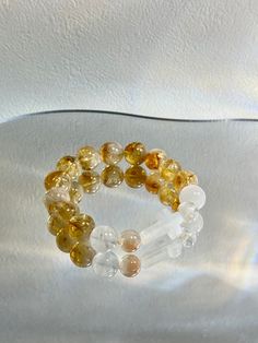 Citrine Crystal Bracelets Handmade and unique design from Merijane ©️ Function: Courage, Dynamic, Balanced Ingredients: Citrine, Clear Quartz, White Phantom Quartz Handmade Clear Bracelets, Phantom Quartz, Citrine Crystal, Groomsman Gifts, Crystal Bracelets, Clear Quartz, Handmade Bracelets, Citrine, Unique Design