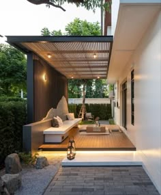 an outdoor living area is lit up with lights