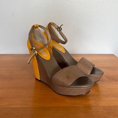 Nwt And Box Banana Republic Vanessa Wedge Sandals In Taupe And Mustard Yellow. Heel Measures 4.5 Inches. Item Comes From A Smoke Free Home. Size 7.5. Yellow Open Toe Synthetic Wedge Sandals, Yellow Heel Strap Wedge Sandals For Summer, Yellow Synthetic Open Toe Wedge Sandals, Chic Yellow Leather Wedge Sandals, Yellow Wedge Sandals With Ankle Strap, Yellow Platform Sandals With Open Heel, Yellow Leather Wedge Sandals For Summer, Yellow Ankle Strap Wedge Sandals, Yellow Summer Wedge Sandals With Open Heel