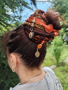 Enhance your witchy vibes with this unique Dreadlock Ponytail! This set features synthetic dreadlocks in striking red and brown hues, secured on an elastic band for easy wear. Perfect for adding a touch of flair to your hairstyle, whether you're headed to a festival, costume party, or just want to express your mystical side. Embrace your whimsical style with this eye-catching hair accessory! 🌞This is a unique piece and I'm happy to create similar ones on request.  Handmade with love, this acces Dreadlock Ponytail, Witchy Hair, Bohemian Hair Accessories, Wiccan Crafts, Festival Costume, Synthetic Dreadlocks, Whimsical Style, Synthetic Dreads, Bohemian Hairstyles