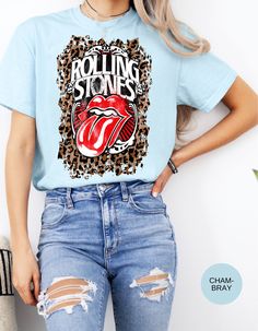 Embrace your inner rocker with our Wild Rocker Vintage Vibes Leopard Tee! This edgy tee combines classic vintage style with a touch of wildness. The bold leopard print design adds a fierce edge, while the relaxed fit ensures comfort. Perfect for pairing with jeans or leggings, this tee is a must-have for music lovers and trendsetters alike. Stand out from the crowd and rock your unique style with this statement tee! - Vintage-inspired leopard print design - Comfortable and stylish fit - Perfect for casual wear or layering - Available in a range of sizes for all body types *Unisex Sizing* - Brand is Comfort Colors Terms and Conditions: Returns, Exchanges and Refunds are honored within the first 30 days of purchase. Shipping Times: please expect 4-7 days to receive your items from the date o Rock Style Graphic Print T-shirt For Fall, Rock Style Graphic T-shirt For Fall, Fall Rock And Roll Style T-shirt With Graphic Print, Leopard Print Graphic T-shirt For Summer, Relaxed Fit Rock T-shirt With Screen Print, White Rocker Graphic Print T-shirt, Summer Leopard Print Graphic T-shirt, Rock And Roll Crew Neck T-shirt With Screen Print, Trendy Leopard Print Graphic T-shirt