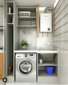 an image of a small laundry room with washer and dryer in the corner