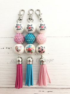 the keychain is decorated with beads and tassels that say best mom