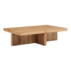 a wooden table sitting on top of a white wall