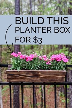 a planter box with pink flowers in it and the words build this planter box for $ 3