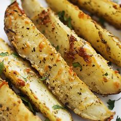 grilled potatoes with herbs and seasoning on a white plate