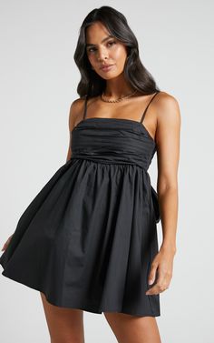 Clover Mini Dress - Back Bow Babydoll Dress in Black | Showpo USA Black Mini Dress With Bow Straps, Flirty Black Dress With Bow, Black Mini Dress With Bow Straps For Date Night, Black Dress With Bow Straps For Date Night, Flirty Black Mini Dress With Bow, Chic Dresses With Bow Straps For Night Out, Chic Black Mini Dress With Bow Tie Back, Black Mini Dress With Bow Tie Back, Chic Mini Bubble Dress For Night Out