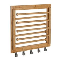 a bamboo rack with four pegs on it