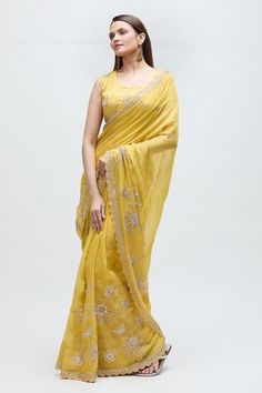 Yellow saree featuring floral gota hand work highlighted with moti and dabka work. Paired with a co-ordinating blouse. - Aza Fashions Pre-draped Saree With Gota Work For Navratri Reception, Reception Gota Work Pre-draped Saree, Art Silk Pre-draped Saree With Gota Work For Reception, Yellow Chanderi Saree For Reception, Chanderi Pre-draped Saree With Dori Work For Reception, Semi-stitched Gota Work Pre-draped Saree For Reception, Eid Reception Pre-draped Saree With Gota Work, Fitted Tissue Silk Saree With Gota Work, Gota Work Saree For Reception