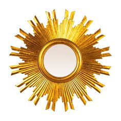 a gold sun shaped mirror is shown against a white background