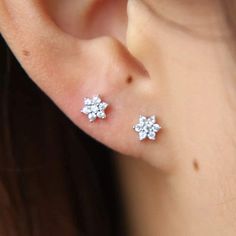 • Our sweet and dainty mini flower earrings are an essential! • Hypoallergenic, lead-free, tarnish/scratch resistant material • Length: Approx. 1.2mm • Material: Surgical Steel, Sterling Silver �• Available in Silver Ear Piercing Studs, Beautiful Flower Designs, Flower Ear, Tiny Studs, Stud Jewelry, Tiny Stud Earrings, Girl Jewelry, Ear Piercing, Flower Earrings Studs