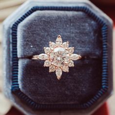 an engagement ring in a velvet box