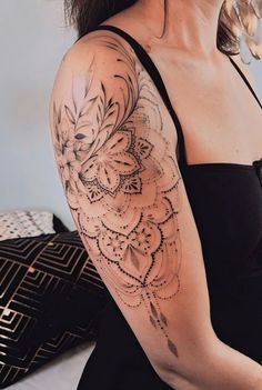 a woman with a tattoo on her arm