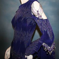 will fit size 3/4-9/10, very stretchy Be ready to make an electrifying entrance onto the dance floor in this Purple Latin-Rhythm-Tango Dress-Lively. Crafted with deep royal purple glitter slinky and an eye-catching pattern, this show stopping dress features one long flared sleeve, one cold shoulder sleeve with flounce and draping Swarovski hand beading, for a look that will take you to the stage and show off your dance moves! Great for social ballroom dances, beginner ballroom-Latin-tango compet Glitter Pattern, Tango Dress, Latin Ballroom, Ballroom Dress, Royal Purple, Purple Glitter, Ballroom Dance, Dance Moves, Dance Floor