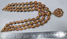 "20 carat solid gold, Old cut Diamonds and multicolor Enamel work necklace (Kundan Meena choker). A large necklace Ideal for special occasions set with eye popping clear old cut genuine Diamonds. A solid piece of jewelry good for family Heirloom which will last for ever. Multicolor enamel at the back giving this piece a unique look of quality, great workmanship and great value for Money. Length of necklace -30 cm (11.81\") Size could be adjusted according to your requirement by adding adjustable Festival Meenakari Pendant Jewelry, Formal Multicolor Kundan Necklaces, Multicolor Formal Jewelry For Diwali, Round Temple Jewelry With Motifs, Temple Jewelry With Round Motifs, Multicolor Hallmarked Temple Jewelry, Ceremonial Multicolor Hallmarked Jewelry, Multicolor Necklaces For Formal Festivals, Formal Round Temple Necklace With Meenakari