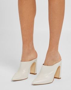 A pointed upper, geometric heel and a sleek shape characterize these leather mules. Made in Italy featuring a leather-lined interior, they’re topped off with a real leather sole. Multiple colors available. , Color: White , Size: 5 Modern Pointed Toe Mules For Formal Occasions, Sleek Pointed Toe Mules With Deep Heel Cup, Sleek Mules With Sculpted Heel And Almond Toe, Sleek High Heel Mules With Sculpted Heel, Pointed Toe Mules With Sculpted Heel For Office, Office Mules With Sculpted Heel And Pointed Toe, Sleek Mules With Reinforced Open Heel, Sleek Leather High Heel Mules, Summer Pointed Toe Mules With Wooden Heel