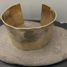 Our wide bronze cuff is hand forged and given a unique textured finish. The forging process creates a slightly different finish on each piece. No two bracelets are exactly alike. A true one of a kind just like you.This is a great idea for a bronze anniversary giftOur current processing time is 5-7 business days. This is the amount of time it takes to create your piece before we ship it. if you need your order sooner we have rush processing available which you can purchase here.https://www.etsy.c Luxury Bronze Cuff Bracelet Gift, Artisan Hammered Gold Cuff Bracelet, Bronze Hand Forged Cuff Bracelet As Gift, Bronze Hand Forged Cuff Bracelet Gift, Hand Forged Bronze Cuff Bracelet For Gift, Hand Forged Bronze Cuff Bracelet Gift, Artisan Hammered Bronze Bracelets, Unique Hammered Bronze Bracelet, Unique Hammered Brass Cuff Bracelet