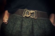 a person wearing a belt with the word icf on it's buckles