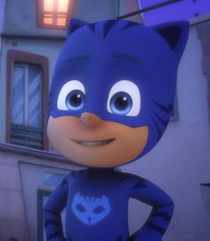 a cartoon character in a blue cat suit standing next to a building with the lights on