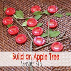 an apple tree made out of red plastic buttons on a wicker mat with the words build an apple tree