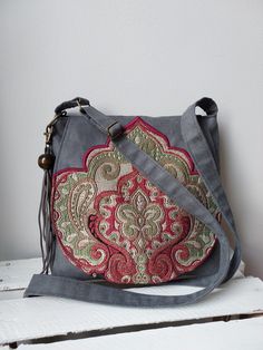 Gray oriental handbag, Vegan messenger bag, Medium sized bag, Oriental purse, Festival bag, Unique clothing accessory ,Gift idea, Vegan bag Very shapely bag that easily fits the most necessary little things. A beautiful addition to your bags collection. 🔴 Bag made of and vegan suede and jacquard, 🔴 Inside the bag will find a lining with two pockets. 🔴 Bag closed by magnetic snap. 🔴 For wearing on a shoulder or diagonally with adjustable, long strap. 🔴 The flap of the bag is decorated with a Vegan Bag, Medium Sized Bags, Festival Bag, Tassel Bag, Vegan Bags, Unique Clothing, Unique Outfits, You Bag, Cross Body Handbags