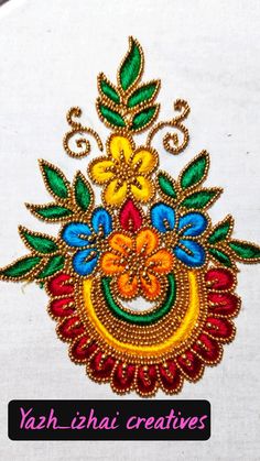 an embroidered design with colorful flowers and leaves on white fabric, which reads yah - chei creatives