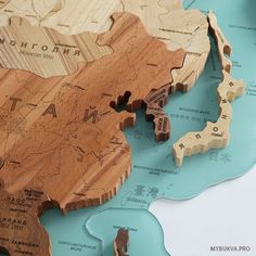 a wooden puzzle with the map of asia