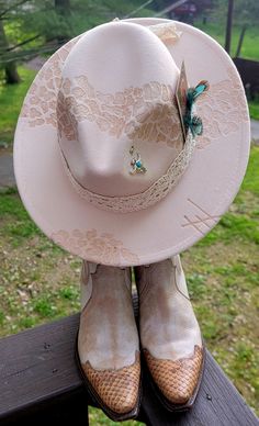 Hand burned Leopard and Lace designed Fedora wide brim cowboy hat with adjustable size inner band. This off white oatmeal color with darker details is sure to be a show stopper.   The tourquise gem and small feather is the perfect touch.  Perfect for concert season,  Bachelorette Party or just everyday going out acdessory.  You will have people stopping you left and right asking where they can get one just like it.   These are made to order, color & decor may vary slightly.  and we can personalize too     Headed to see Jelly Roll, Lainey Wilson, Morgan Wallen, Cody Johnson, Luke Combs or Zach Bryan, you will want one for sure, pair it with your White knee length boots, and become TikTok famous.    We have other colors avail, and ready for your vision, just shoot us a message with your idea Luxury Bohemian Cowboy Hat For Western-themed Events, Cowboy Hat Decorations Ideas, Wedding Cowboy Hat, Lainey Wilson Inspired Hat, Handmade Western Fedora For Western-themed Events, Hand Painted Short Brim Hat For Western-themed Events, Lainey Wilson Cowboy Hat, Luxury Country-style Cowboy Hat For Festivals, Cowboy Hat Crafts