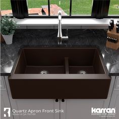 a kitchen sink with two faucets in it