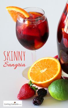 two glasses of sangria with fruit on the side and an orange slice next to it