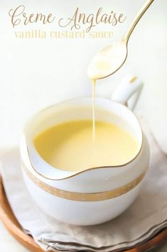 a spoon is pouring some liquid into a white bowl on top of a cloth with the words creme analise vanilla custard sauce