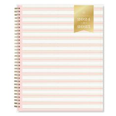 a pink and white striped notebook with gold foil