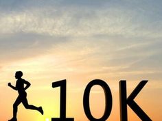 the silhouette of a man running in front of a number 10k sign at sunset