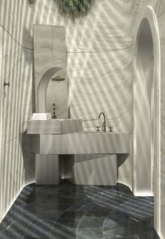 a bathroom with a sink, mirror and shower in it's center wall is shown