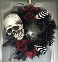 a wreath decorated with fake flowers and skulls