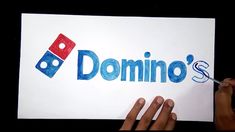 someone is writing the word domino's on a piece of paper