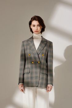 The Madison Plaid blazer is tailored to fit and features a fitted waistline with double-breasted vintage alloy buckles. This classic silhouette offers endless styling possibilities for your winter wardrobe. Model is 172cm / 5'6" and is wearing a size S. Please see Size Chart. Fitted Double-breasted Tweed Jacket For Fall, Fall Double Breasted Suit With Hidden Buttons, Chic Double-breasted Office Sport Coat, Double Breasted Suit With Lapel Collar For Fall, Double-breasted Suits With Hidden Button Closure For Fall, Timeless Double-breasted Fitted Outerwear, Timeless Fitted Double-breasted Outerwear, Classic Double-breasted Tweed Jacket, Classic Double-breasted Blazer Dress For Fall