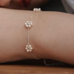 Freshwater Pearl Flower Station Bracelet,Daisy Charm Bracelet,Natural Pearl Jewelry,Minimalist Handmade Jewelry,Gift for Her (BR2190) ▶ Product Info. - Material: Brass / Freshwater pearl / Cubic Zirconia - Metal Finish: 14K Gold / Silver + Anti-Tarnish E-Coat  - Safety: Nickle & Lead free and Haypoallergenic - Dimensions: Flower - 9.1mm - Length: 16cm + 3cm (length adjustable) - Weight: 2.28g - TATIANA logo tag was added. - Made In South Korea Our jewelry was plated with a hight-content gold/silver layer to minimize the discoloration, compared to regular non-plating one. ▶Shipping and Return Policies Order today to get by Date (14days) Return & exchanges accepted within 30days Cost to ship : USD 7.00 ▶Cancellations Cancellations : accepted Request a cancellation : before item has shipped. Handmade Delicate Pearl Bracelet With Flower Shape, Handmade Delicate Pearl Bracelet With Flower Design, Delicate Handmade Flower Pearl Bracelet, Handmade Flower-shaped Pearl Bracelet As A Gift, Handmade Flower-shaped Pearl Bracelet Gift, Adjustable Flower Pearl Bracelet, Flower Station, Natural Pearl Jewelry, Station Bracelet