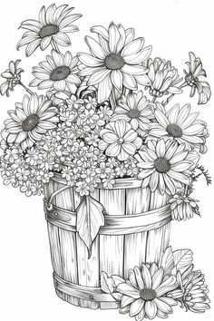 a basket filled with lots of flowers sitting on top of a white table next to a wooden