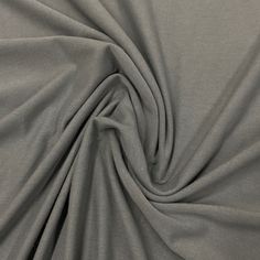 a close up shot of a plain grey fabric