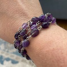 This Is A Beautiful Bracelet Made With 4 Strands Of Natural Amethyst Beads And Silver Tone Base Metal. It Will Best Fit Wrist Size 7.0 To 7.50 Inches. The Clasp Is Made Of Silver Tone Base Metal. New With Tags. Vintage Amethyst Bracelet Jewelry, Vintage Purple Metal Bracelets, Adjustable Hand-strung Amethyst Stretch Bracelet, Vintage Beaded Bracelet, Hand-strung Amethyst Bracelets In Bohemian Style, Bohemian Hand-strung Amethyst Bracelets, Handmade Skulls, Red Beaded Bracelet, Coil Bracelet