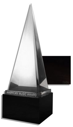 an american music award is displayed on a white background