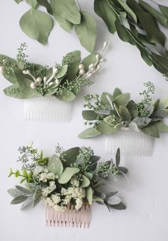 two hair combs with flowers and greenery on the top one has a video playing