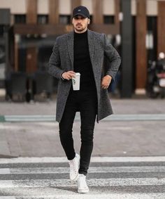 Men's Smart-Casual Winter Outfit: Grey Coat & White Sneakers"Description: "Stay stylish and comfortable this winter with a smart-casual men's outfit featuring a grey overcoat, black jeans, and white sneakers. Perfect for a modern and effortless look, this outfit combines sophistication with everyday wearability. Complete the ensemble with a casual cap and a warm coffee in hand for a laid-back yet chic vibe. Explore more men's winter fashion and outfit ideas here."Tags: #MensFashion #WinterOutfit #SmartCasual #GreyCoat #WhiteSneakers #StreetStyle #MensWear #CasualLook #MensStyle #FashionInspiration Long Coat Men, Mens Business Casual, Mens Business Casual Outfits, Herren Style, Mens Business, Mens Casual Outfits Summer, Men Fashion Casual Shirts, Stylish Men Casual, Fall Outfits Men