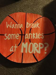 a sign that says, wanna break some ankles at morp? on a basketball